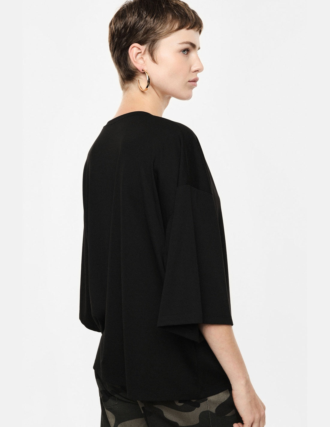 Top ample manches chauve-souris col V noir Imperial vue portée de dos